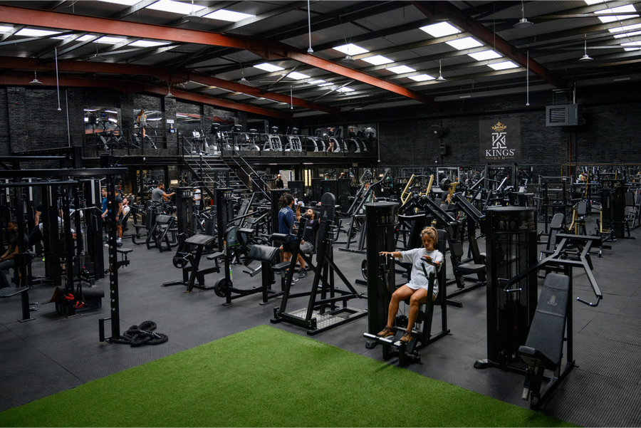 A member training on the gym floor at Kings Gym Mitcham